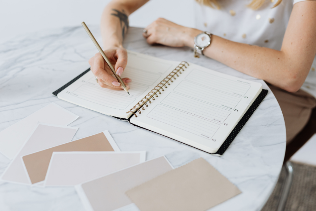 blank planner with lady writing in it